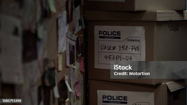 Boxes With Evidential Materials At Police Office Investigation Process Case Stock Photo - Download Image Now