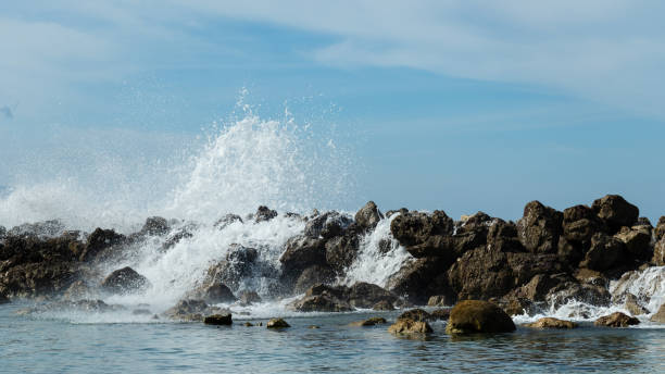 istock Ocean waves crash over rocks along the shore. 1085798874