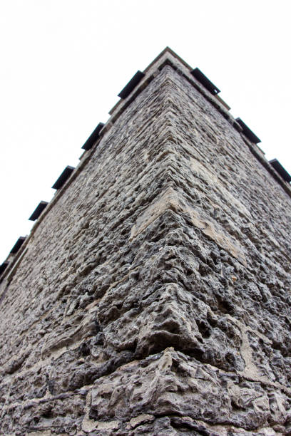 corner of a stone wall on a castle - corner stone wall brick imagens e fotografias de stock
