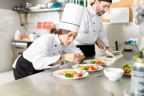 istock Cook Dressing Food At Kitchen Counter 1085831782