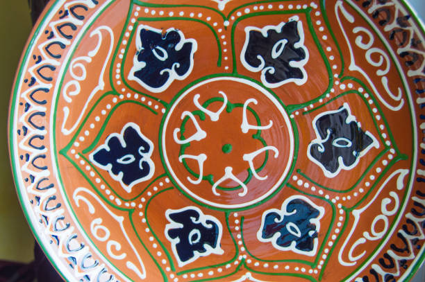 istock Traditional authentic colorful hand-painted Asian ceramic souvenir plate 1085839886