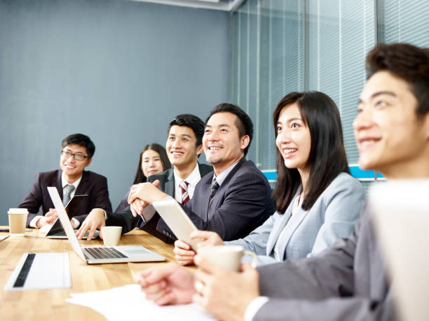 istock asian business people laughing during meeting 1085848480