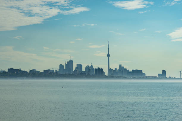 istock Toronto Skyline with mist floating on the sea 1085848620