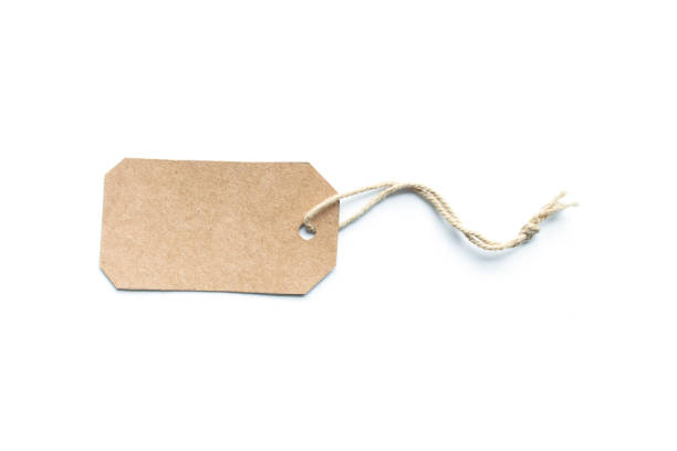 istock Blank brown cardboard price tag or label tag with thread isolated on white background. 1085872898