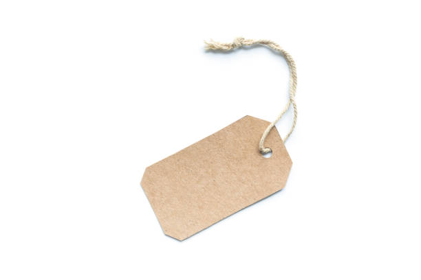 istock Blank brown cardboard price tag or label tag with thread isolated on white background. 1085872904