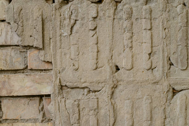 istock Texture of old cement wall with bulges on the surface. Can be used as background. 1085874544