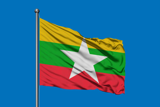 bandera de myanmar ondeando en el viento contra el cielo azul profundo. bandera de birmania. - himno nacional turco fotografías e imágenes de stock