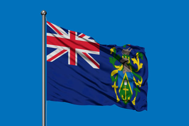 Flag of Pitcairn Islands waving in the wind against deep blue sky. Flag of Pitcairn Islands waving in the wind against deep blue sky. henderson waves stock pictures, royalty-free photos & images