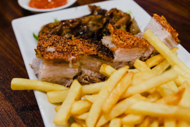istock Crispy Pork Belly and fries 1085889334