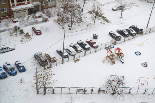 istock Cars in parking are covered snow 1085899458