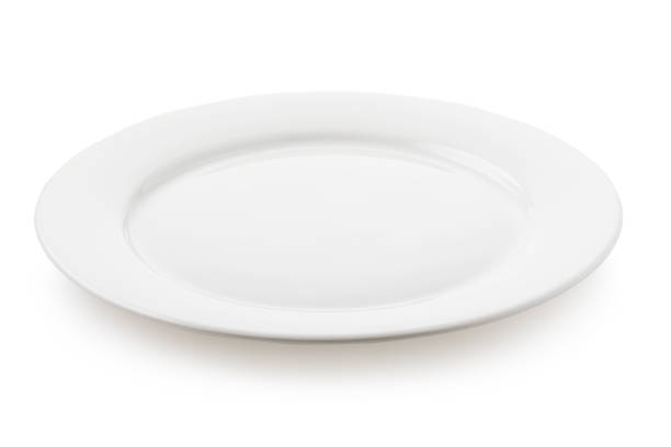 istock Empty ceramic plate white color, a side view of the isolated object 1085904304