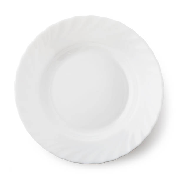 istock White ceramic plate, top view of an isolated object 1085904456