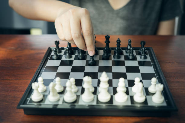 istock Businessman holding a King Chess is placed on a chessboard.using as background business concept and Strategy concept with copy space for your text or design. 1085905786