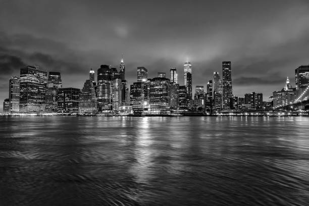istock manhattan night view from brooklyn in black and white 1085915394