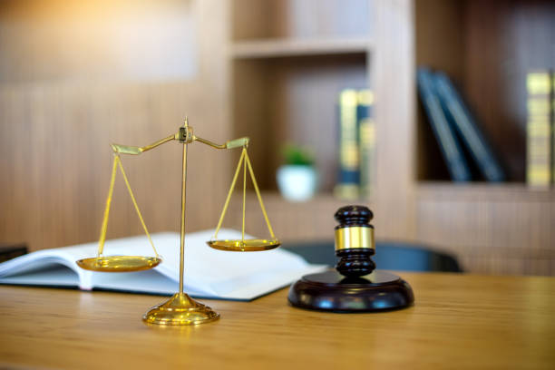 istock gavel and balance on the table with book 1085917232