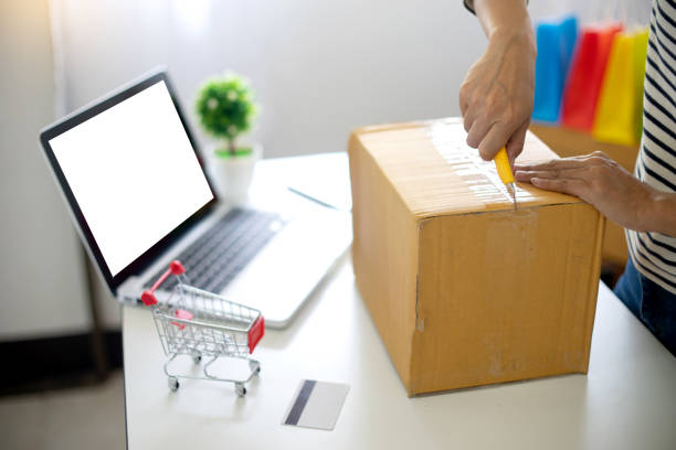 istock woman sit at computer table look at the product 1085917256