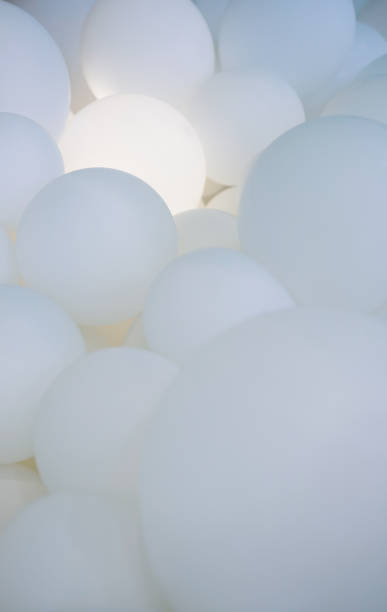 istock group of white balloons with light 1085917556
