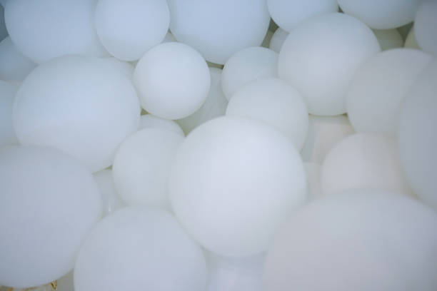 istock group of white balloons with light 1085917568
