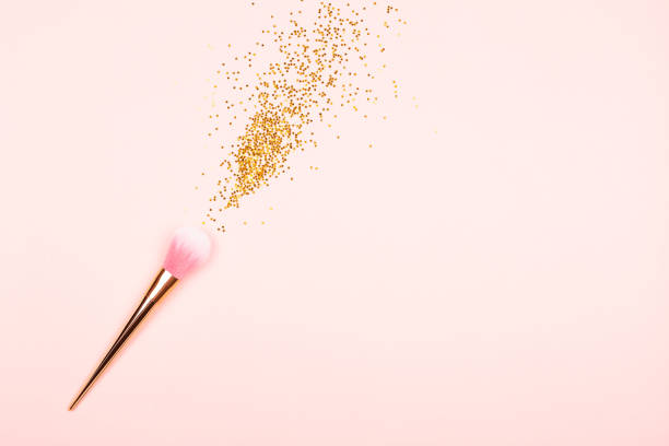 istock Pink makeup brush and confetti 1085918758