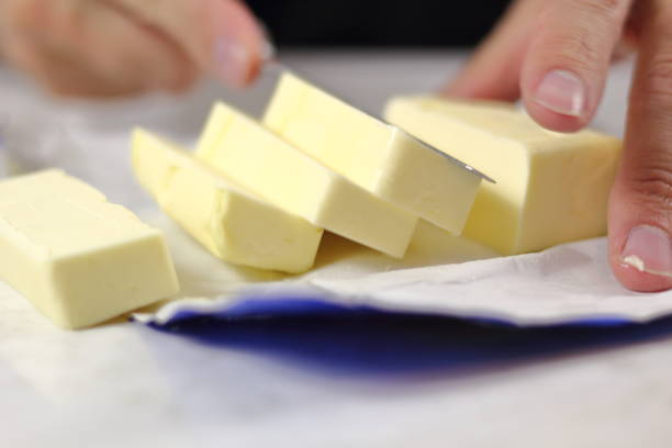 istock Chef dicing butter. Making Lemon Mascarpone Pie Series. 1085919426