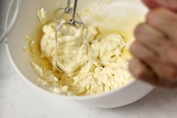 istock Whisking cheese filling with mixer. Making Lemon Mascarpone Pie Series. 1085921548
