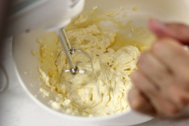 istock Whisking cheese filling with mixer. Making Lemon Mascarpone Pie Series. 1085921642
