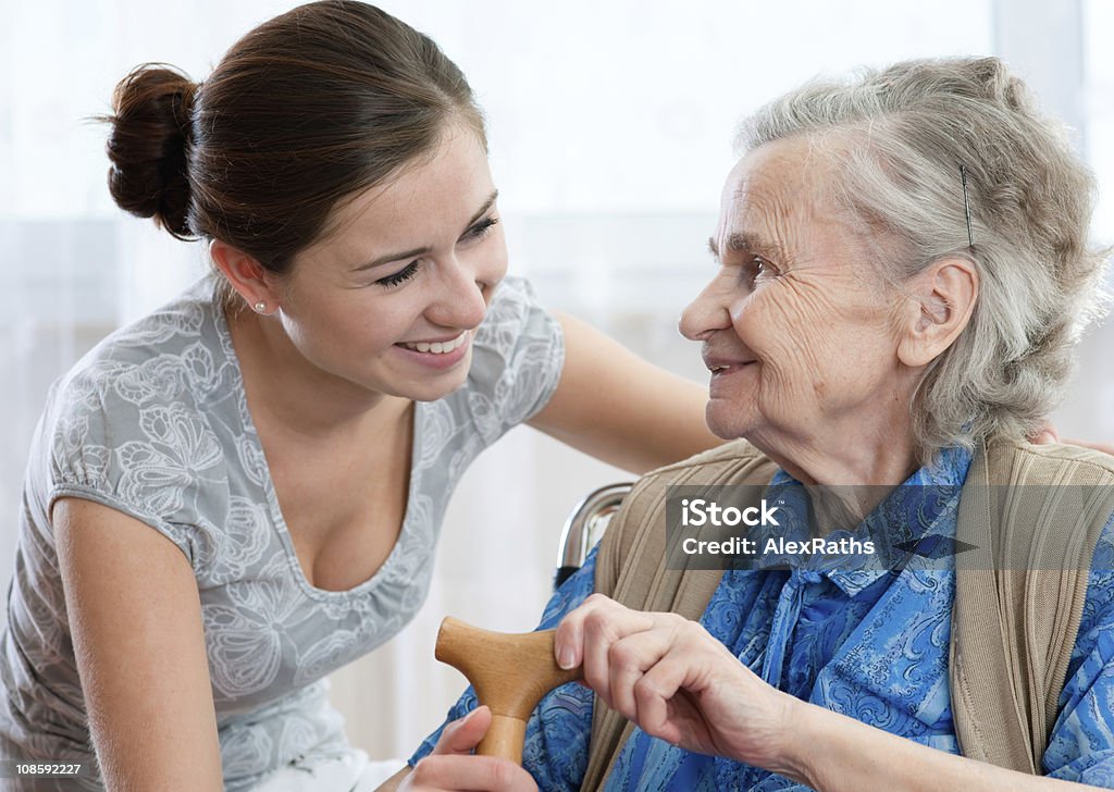 care Senior woman with her home caregiver. 80-89 Years Stock Photo