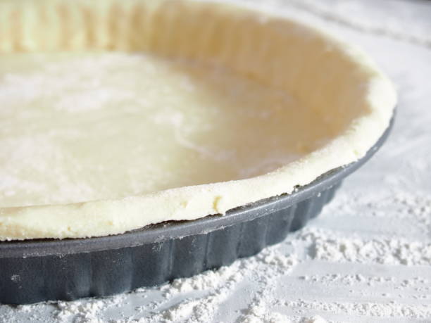 istock Pastry Case in Fluted Tin. Making Treacle Pie Series. 1085925104