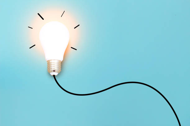 istock Ideas with  light bulb on blue background .Creative business concept. 1085928084