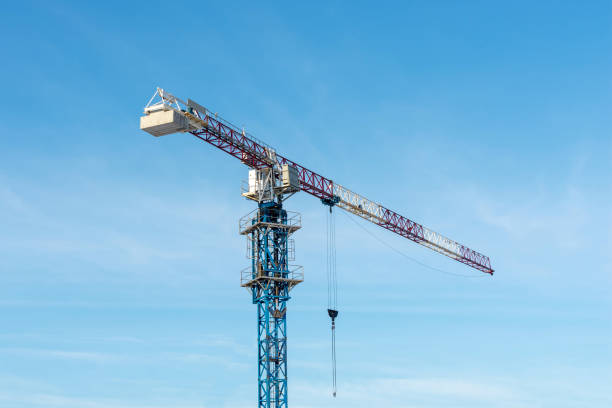 istock Jib crane. Construction crane against blue sky. 1085928442