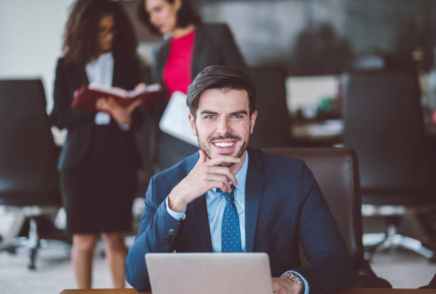 istock Smiling businessman's portrait in the office 1085928668