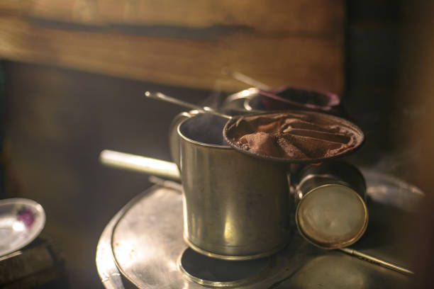 Unrecognizable man preparing morning coffee.