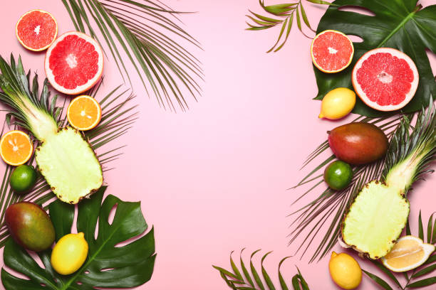 istock Tropical summer background with various tropical fruits 1085932578