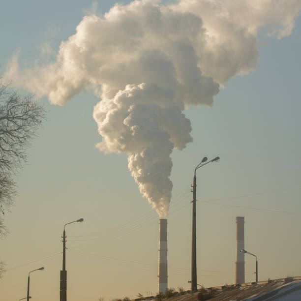 istock Smoke from industrial chimneys against the blue sky. Pollution. 1085941148