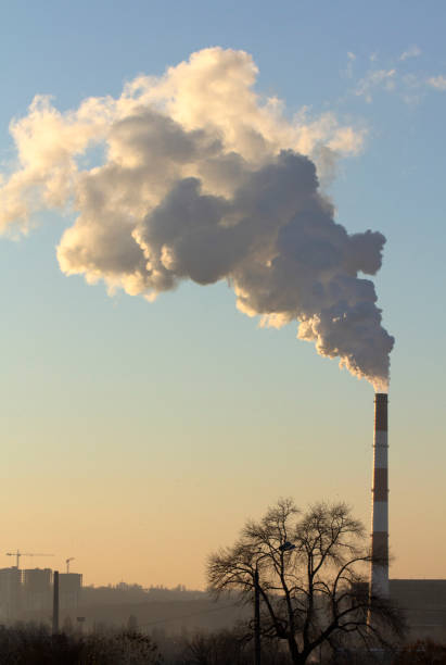 istock Smoke from industrial chimneys against the blue sky. Pollution. 1085941162