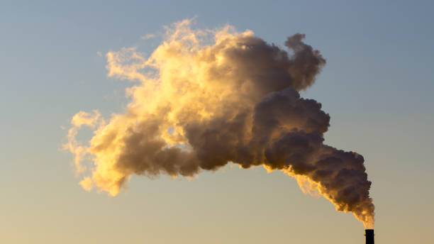 istock Smoke from industrial chimneys against the blue sky. Pollution. 1085941700