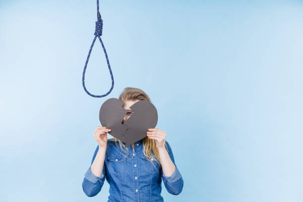Woman covering her face by her hand with a centimeter