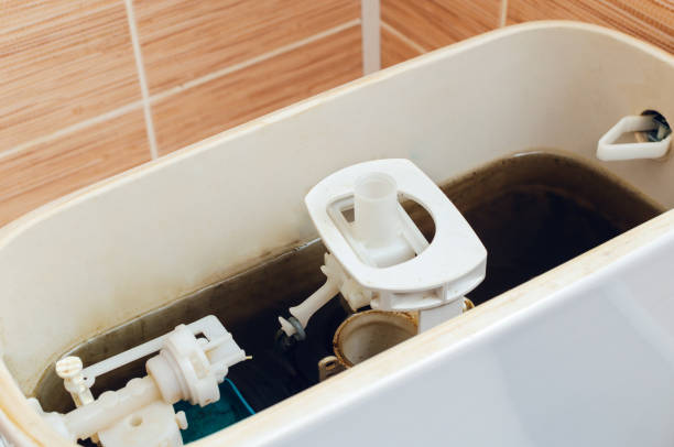 istock Dirty rusty water in the toilet drain tank 1085950196