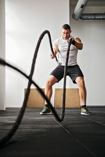 strength training in a gym with rope