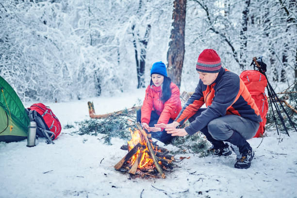 istock Tourists on a halt in the winter forest 1085962218