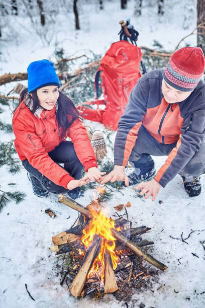 istock Tourists on a halt in the winter forest 1085962224