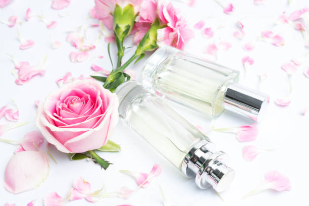 istock Beautiful perfume bottles on pink background 1085968100