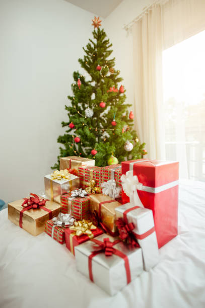 istock Christmas tree and many present boxes.in bedroom. 1085974054