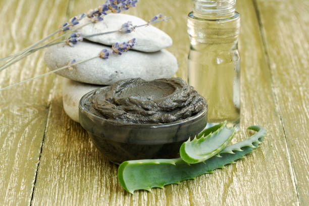 istock cosmetic mud mask with aloe vera, lavender and essential oil. 1085977150