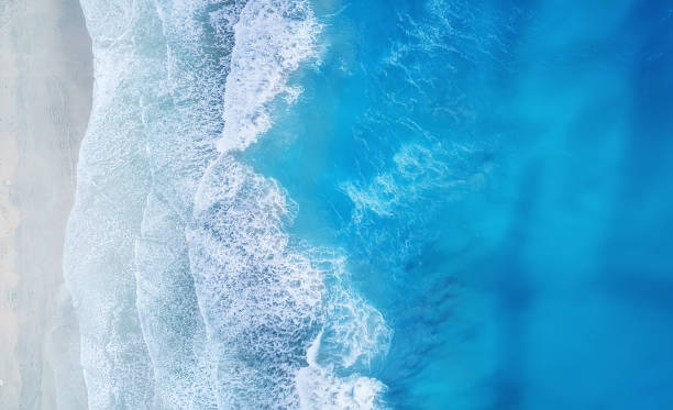 istock Beach and waves from top view. Turquoise water background from top view. Summer seascape from air. Top view from drone. Travel concept and idea 1085977792