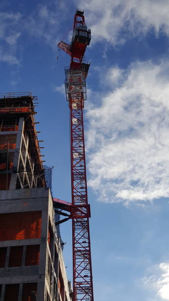 istock The crane vertical view tall view with building Orange squares and sky 1085981304