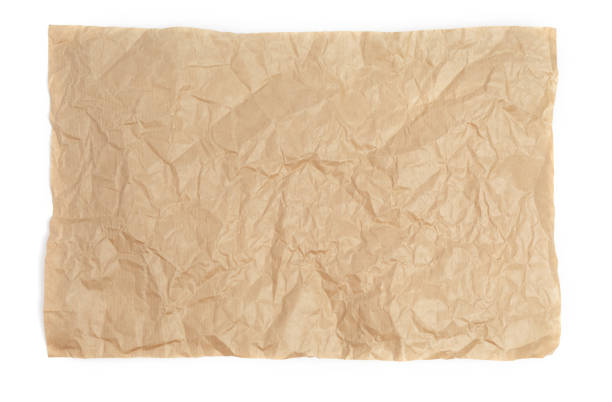 istock Crumpled sheet of kraft paper on a white background as a template for a backdrop 1085981480