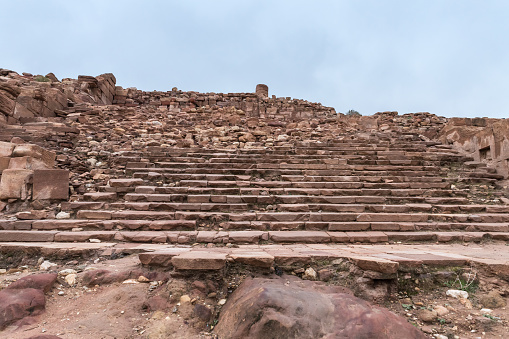 Wadi Musa, Jordan, December 06, 2018 : The remains of the wide steps of the stairs leading to the temple from the time of the Roman Empire in Petra. Near Wadi Musa city in Jordan