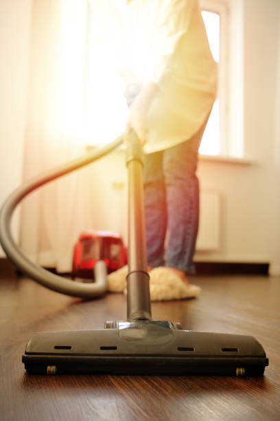 istock Girl vacuuming 1085985146