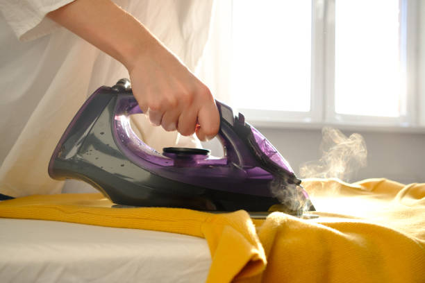 istock Girl ironing clothes 1085985290